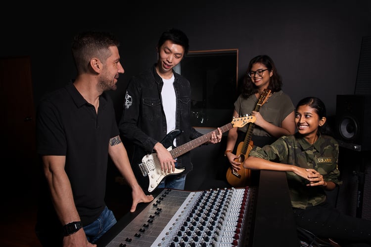 A group of students talking heartily.